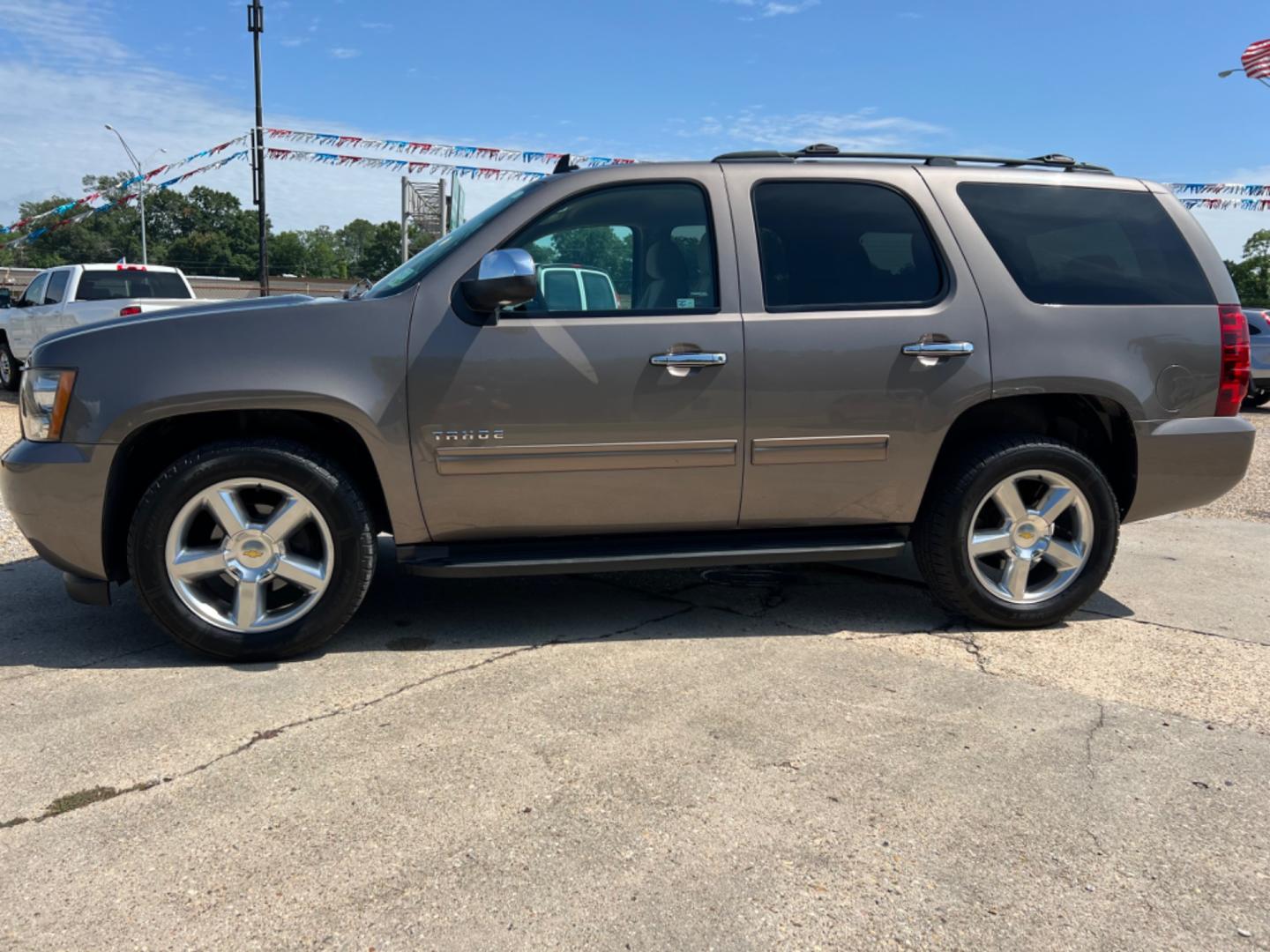 2014 Brown /Tan Chevrolet Tahoe LS (1GNSCAE04ER) with an 5.3L V8 engine, Automatic transmission, located at 4520 Airline Hwy, Baton Rouge, LA, 70805, (225) 357-1497, 30.509325, -91.145432 - 2014 Chevy Tahoe LS 5.3 V8 Gas, 147K Miles, 8 Passenger Seating, Backup Camera, Power Windows, Locks & Mirrors, Cold A/C, Tow Pkg. FOR INFO PLEASE CONTACT JEFF AT 225 357-1497 CHECK OUT OUR A+ RATING WITH THE BETTER BUSINESS BUREAU WE HAVE BEEN A FAMILY OWNED AND OPERATED BUSINESS AT THE SAME LOCA - Photo#1